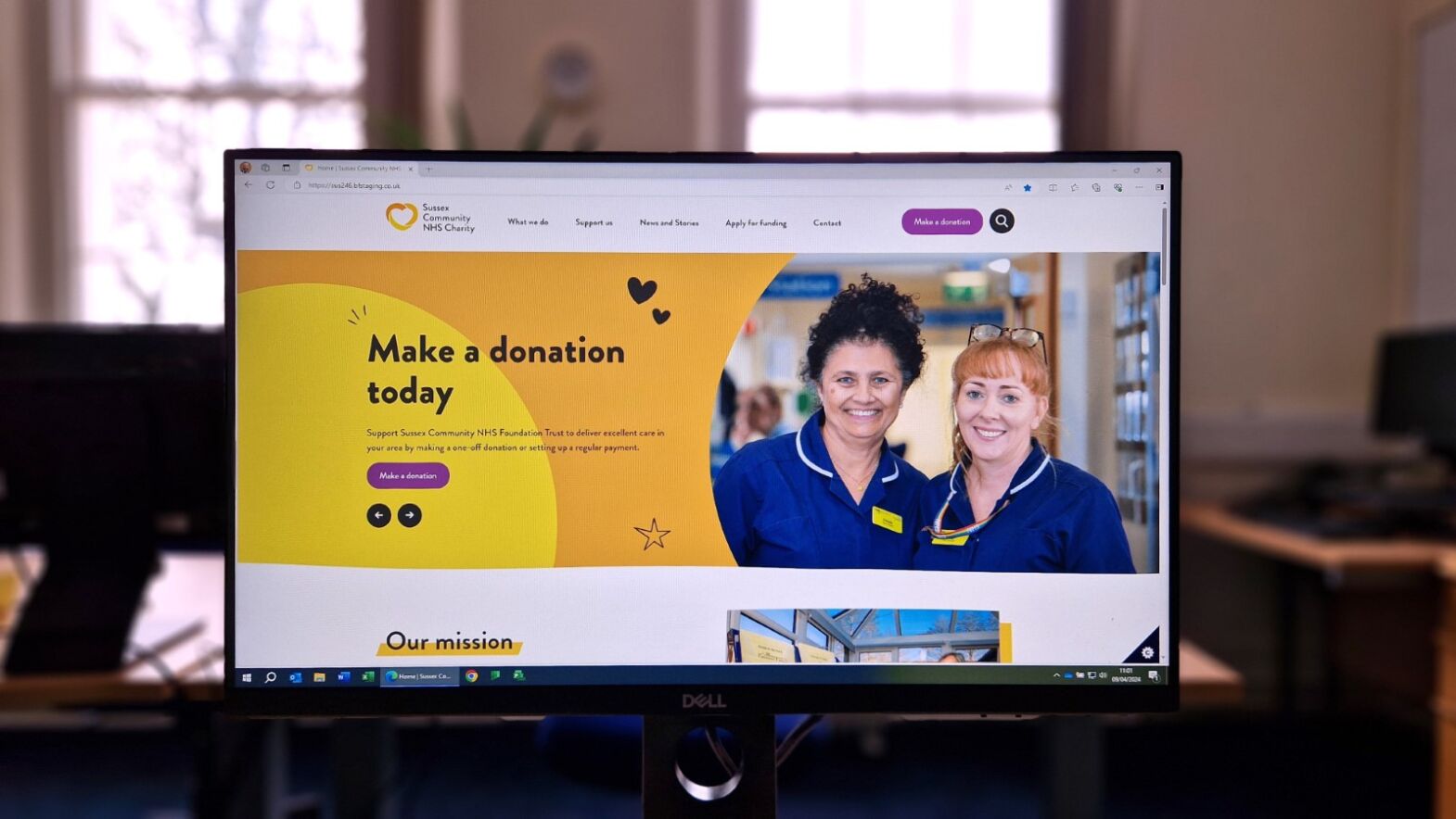 A computer with the new Charity website.