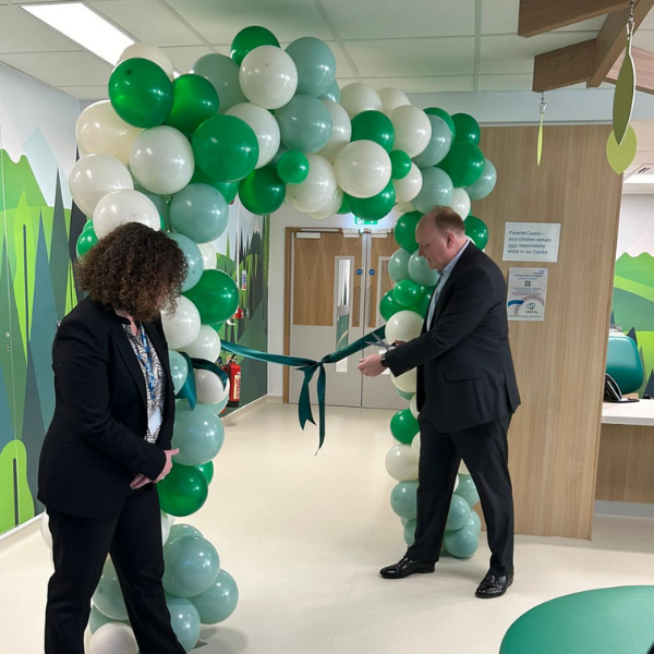 Siobhan Melia and Giles York cutting the ribbon to open the Crawley Child Development Centre
